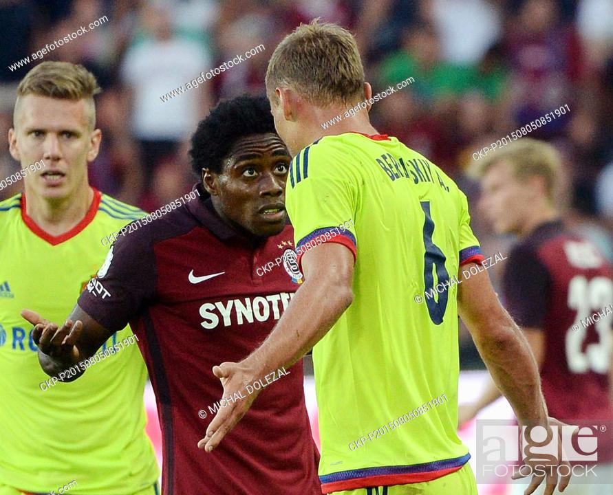 Stock Photo: Tiemoko Konate, of Sparta, left to right, and Aleksei Berezutski of CSKA Moscow discuss during the third qualifying round of the Champions League return match.