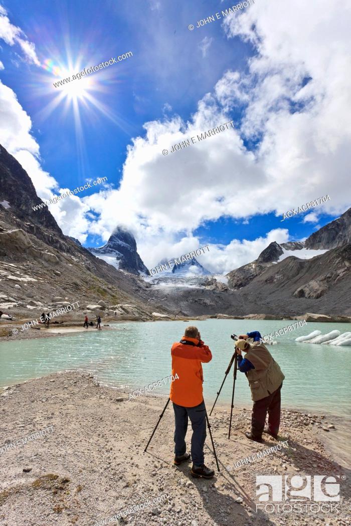 Stock Photo: Landscape photographers taking pictures of the Vowell Glacier and Howser Tower in the Bugaboo Mountains, BC, Canada.