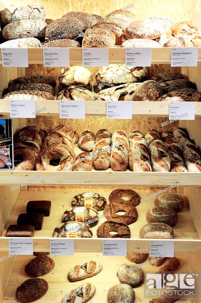 Stock Photo: Different kinds of coarse rye bread in rack, bread loaves.