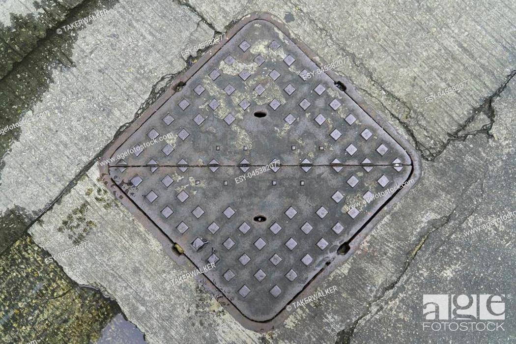Stock Photo: Steel drain hatch classic view and square.