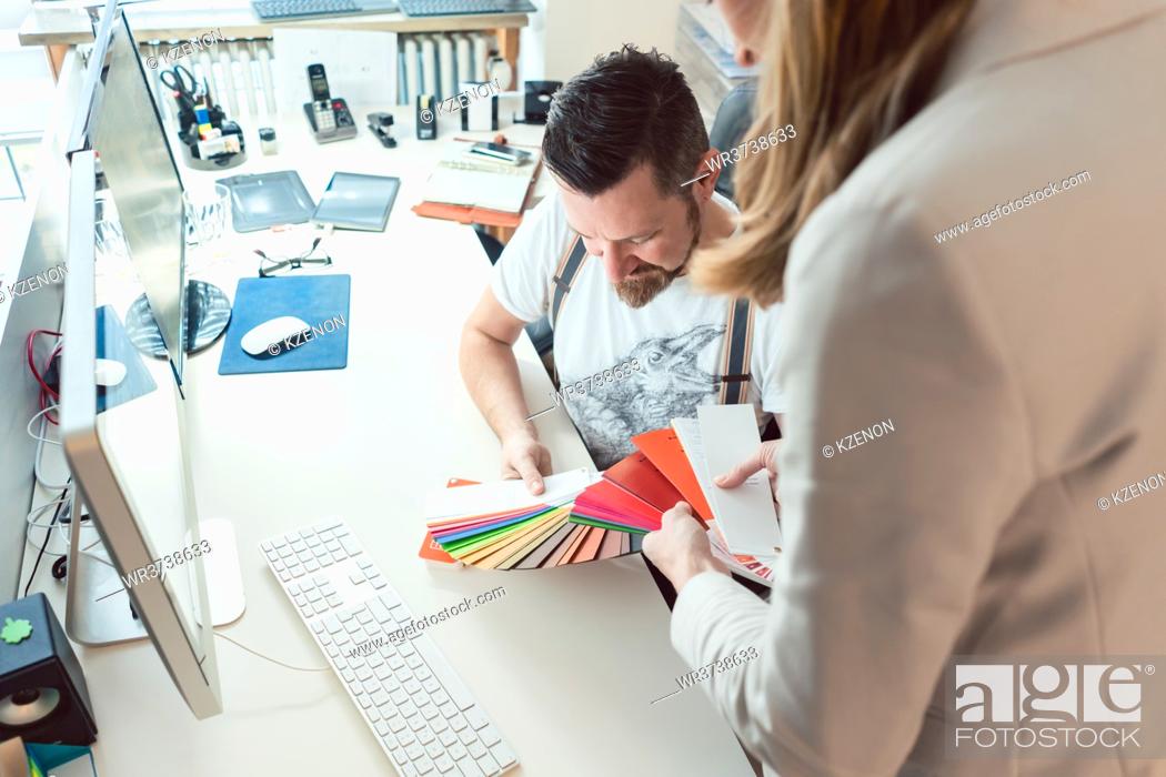 Photo de stock: Creatives working in team checking colors for advertising project in the agency.