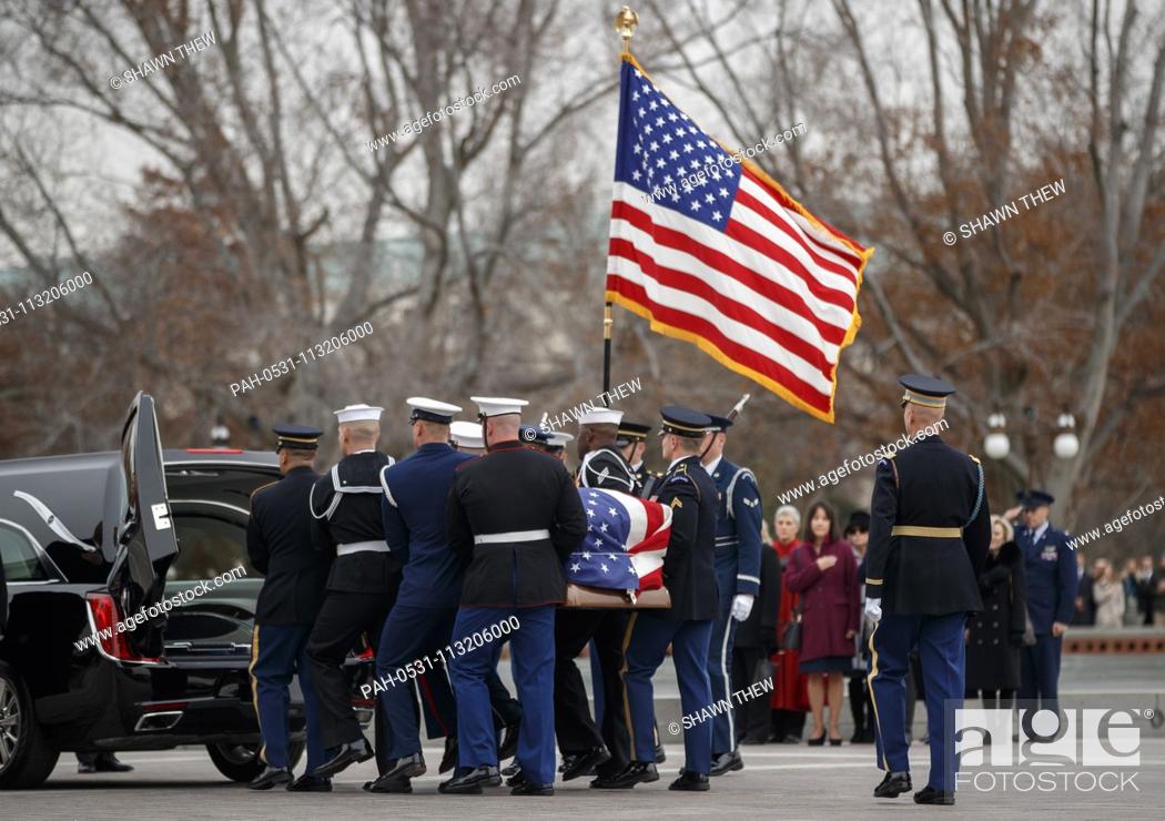 Stock Photo: A joint service honor guard carries the casket of former US President George H.W. Bush out of the US Capitol in Washington, DC, USA, 05 December 2018.