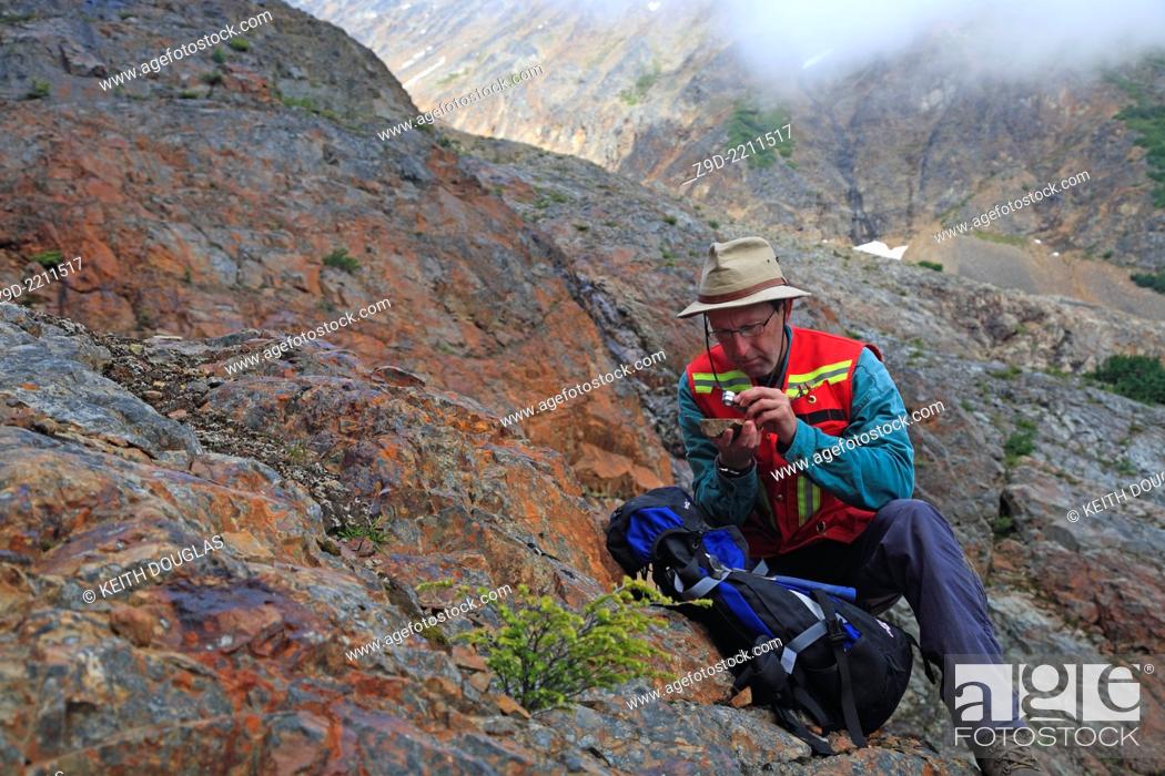 Stock Photo: Geologist doing field work, Hudson Bay mountain, Smithers, British Columbia.