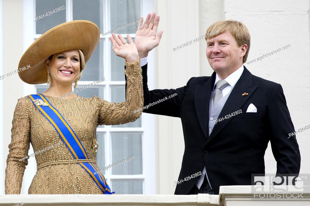 Stock Photo: Dutch King Willem-Alexander and Queen Maxima wave to the crowd from the balcony of the Palace Noordeinde in The Hague, The Netherlands, 17 September 2013.