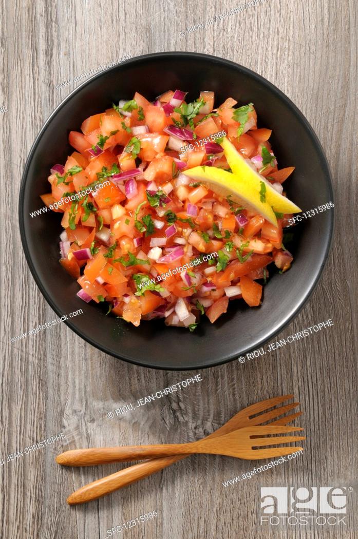 Stock Photo: Tomato salsa with red onions.