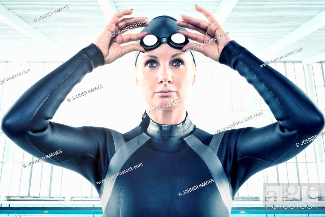 Stock Photo: Mid adult woman in wetsuit.