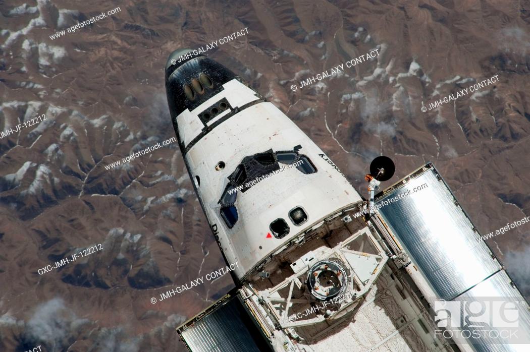 Stock Photo: This view of the cabin and forward cargo bay of the space shuttle Discovery was provided by an Expedition 23 crew member during a survey of the departing.