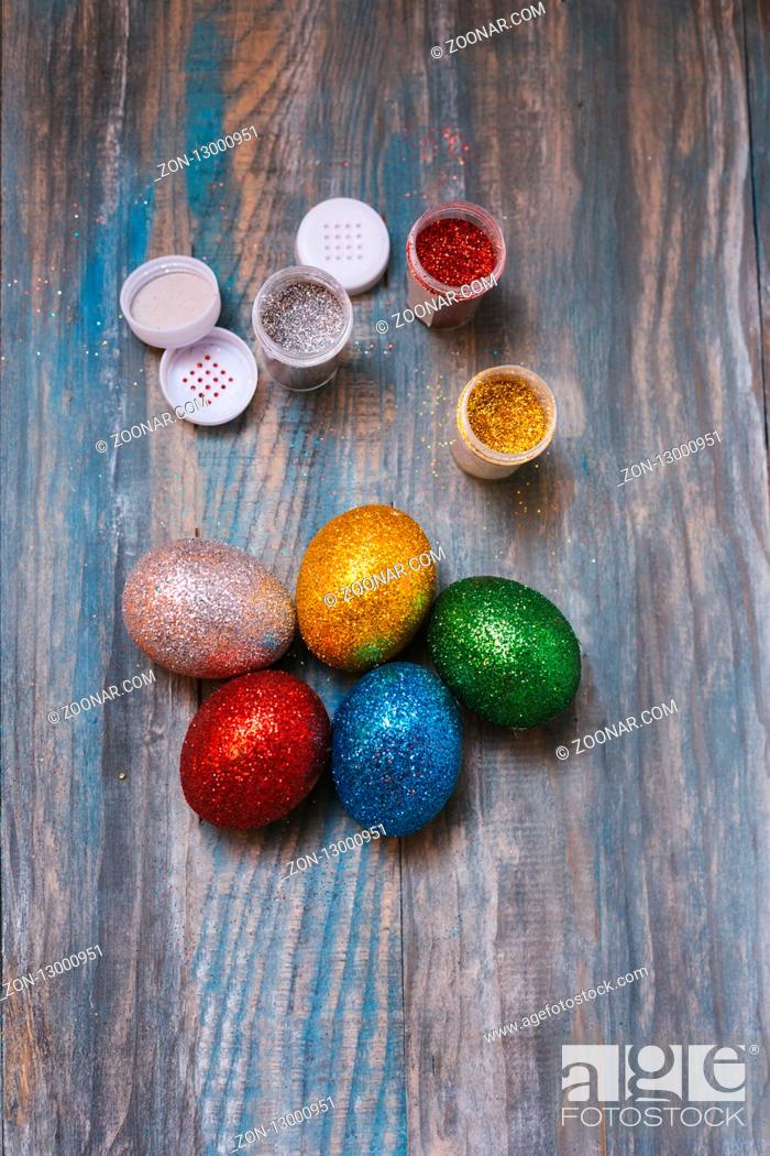 Stock Photo: Easter eggs on wooden table. Holiday background.