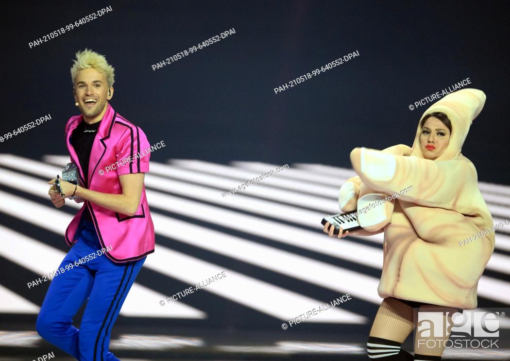 Stock Photo: 17 May 2021, Netherlands, Rotterdam: Singer and musical performer Jendrik performs during the second dress rehearsal of the first semi-final of the Eurovision.