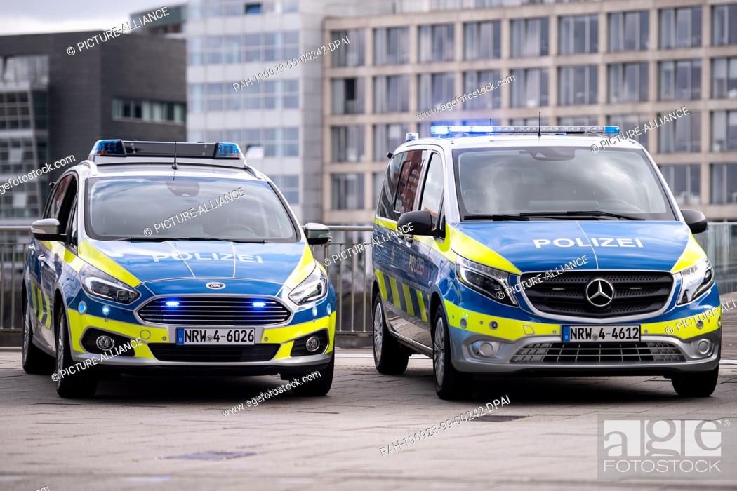 Stock Photo: 23 September 2019, North Rhine-Westphalia, Duesseldorf: New Mercedes Benz Vito (r) and Ford S-Max police cars are parked in the Media Harbour.