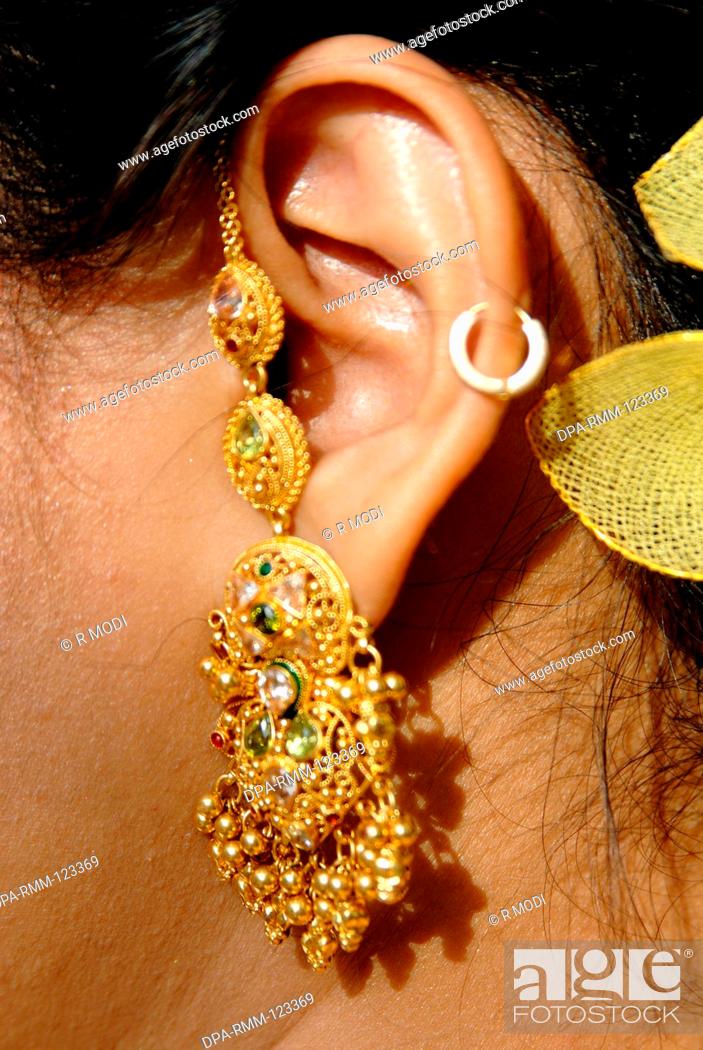 Close ups of South Asian Indian lady with ear ornament earring and hair  style with green leaves ;..., Stock Photo, Picture And Rights Managed  Image. Pic. DPA-RMM-123369 | agefotostock