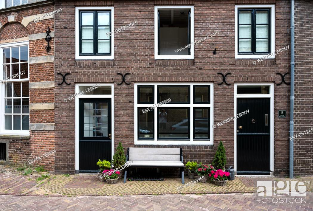 Stock Photo: Hattem, Gelderland, The Netherlands, 07 14 2022 - Traditional facades of decorated houses.