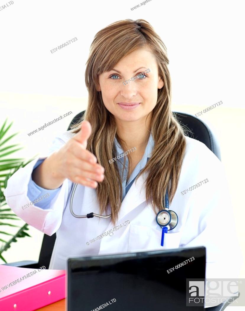 Stock Photo: Confident female doctor looking at the camera in her office.
