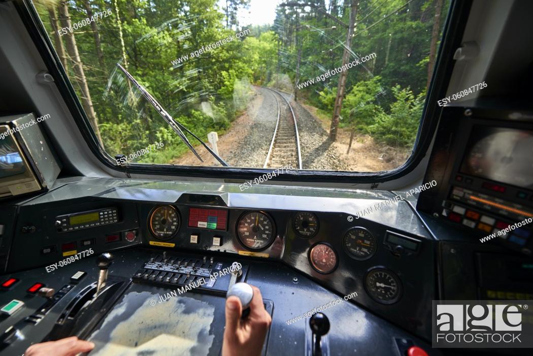 Stock Photo: Interior view of the pilot hands and instrument panel cockpit of ancient train.