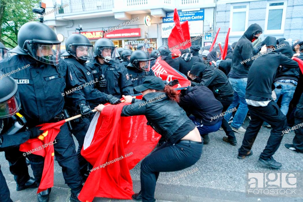 Stock Photo: The police stop demonstrators and force them onto a shortened route during the May Day demonstration in Hamburg, Germany, 01 May 2014.