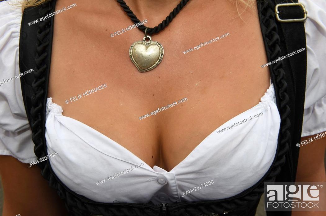 Stock Photo: A woman's cleavage during the opening of Oktoberfest in Munich,  Germany, 20 September 2014. A one-litre stein of Bavarian ale will cost up to 10.