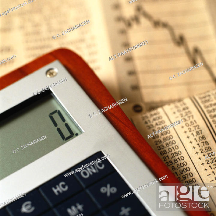 Photo de stock: Calculator on top of financial charts.