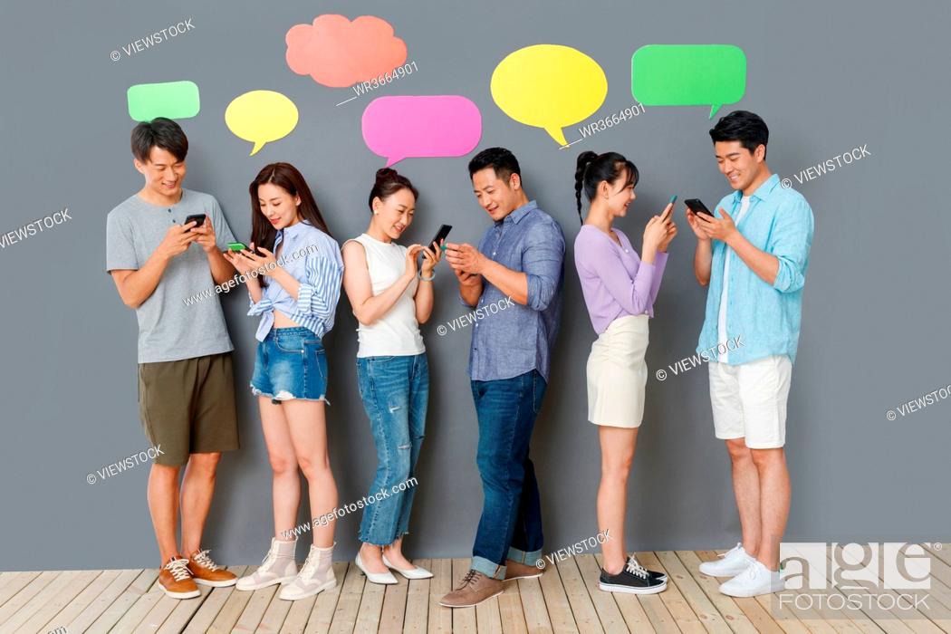 Stock Photo: Happy couples use mobile phone chat software to communicate.