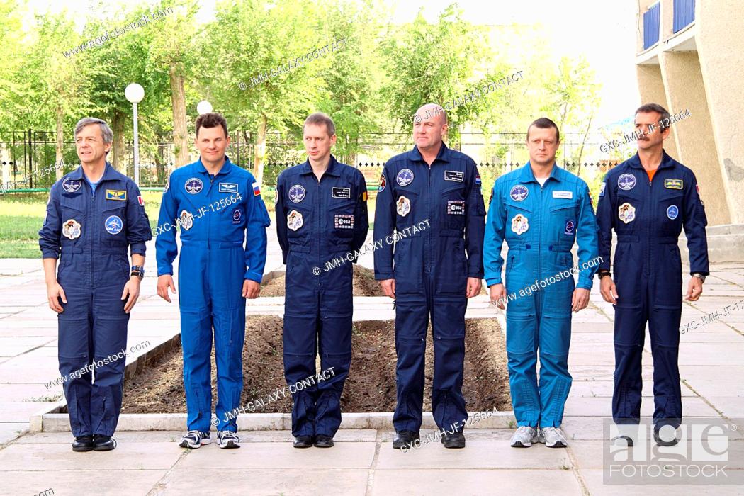 Stock Photo: At the Cosmonaut Hotel crew quarters in Baikonur, Kazakhstan, the prime and backup crews for Expedition 20 pose for pictures as part of their traditional.
