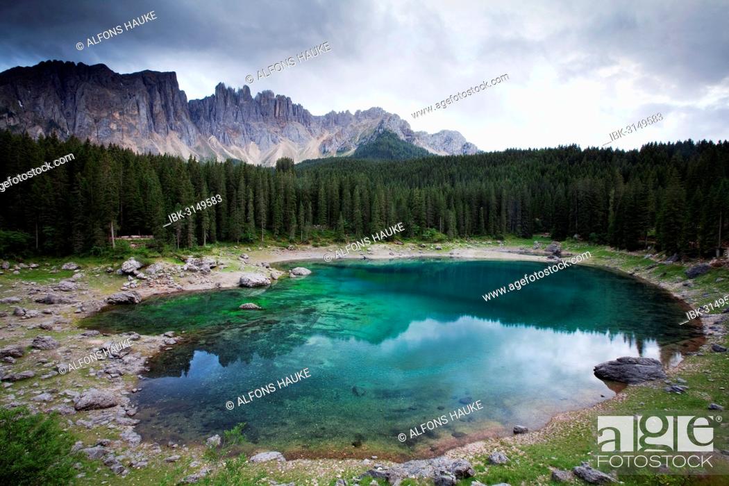 Stock Photo: Lake Carezza with Latemar Mountain with clouds, Karerpass, Dolomiten, South Tyrol province, Trentino-Alto Adige, Italy.