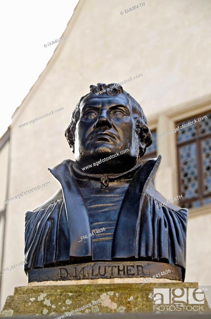 Stock Photo: Martin Luther bust in front of the birth house in Eisleben, Saxony-Anhalt, Germany.