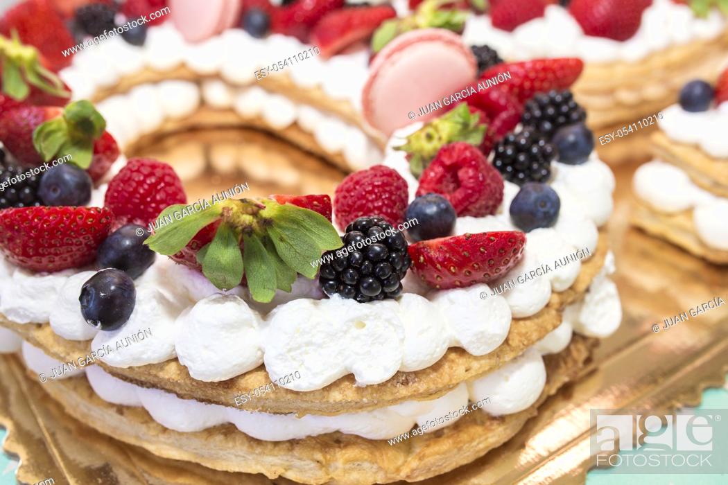 Stock Photo: Fruits of the forest cake with cream and pastry. Closeup.
