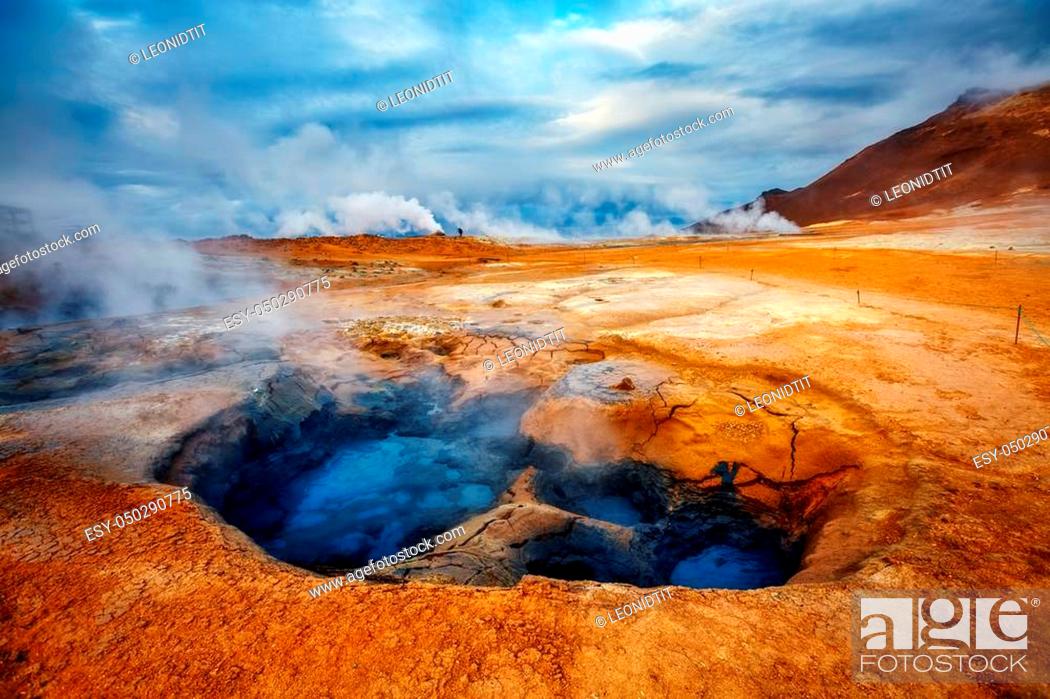 Stock Photo: Ominous view geothermal area Hverir (Hverarond) near Lake Myvatn. Popular tourist attraction. Dramatic and picturesque scene.
