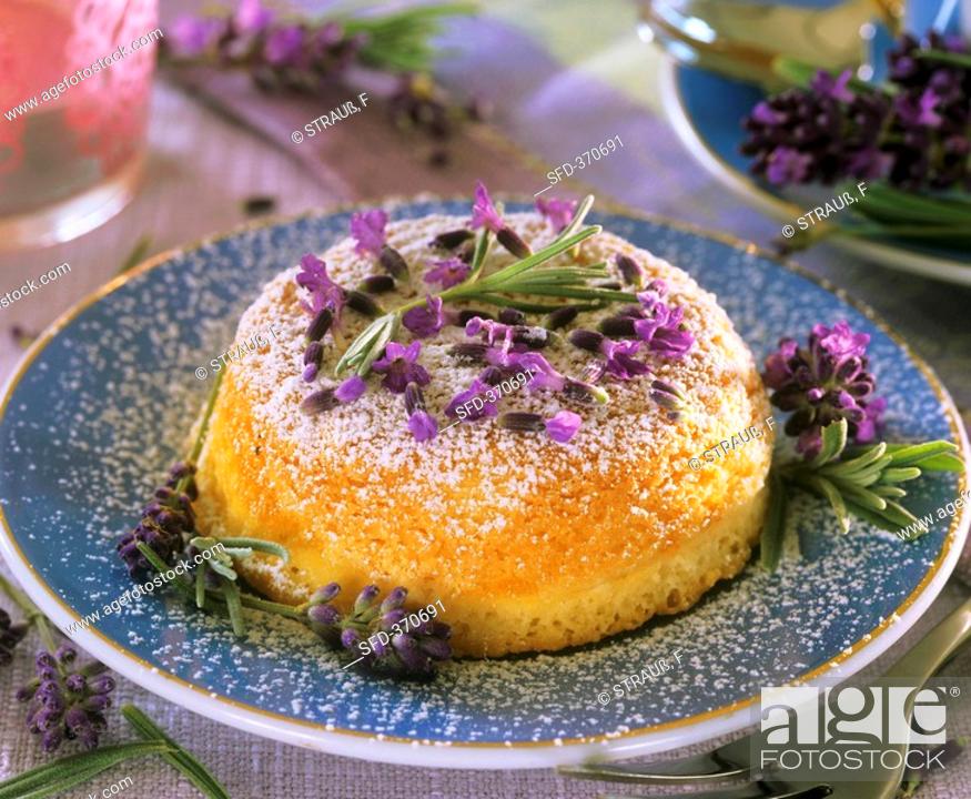 Stock Photo: Small cake sprinkled with lavender and icing sugar.