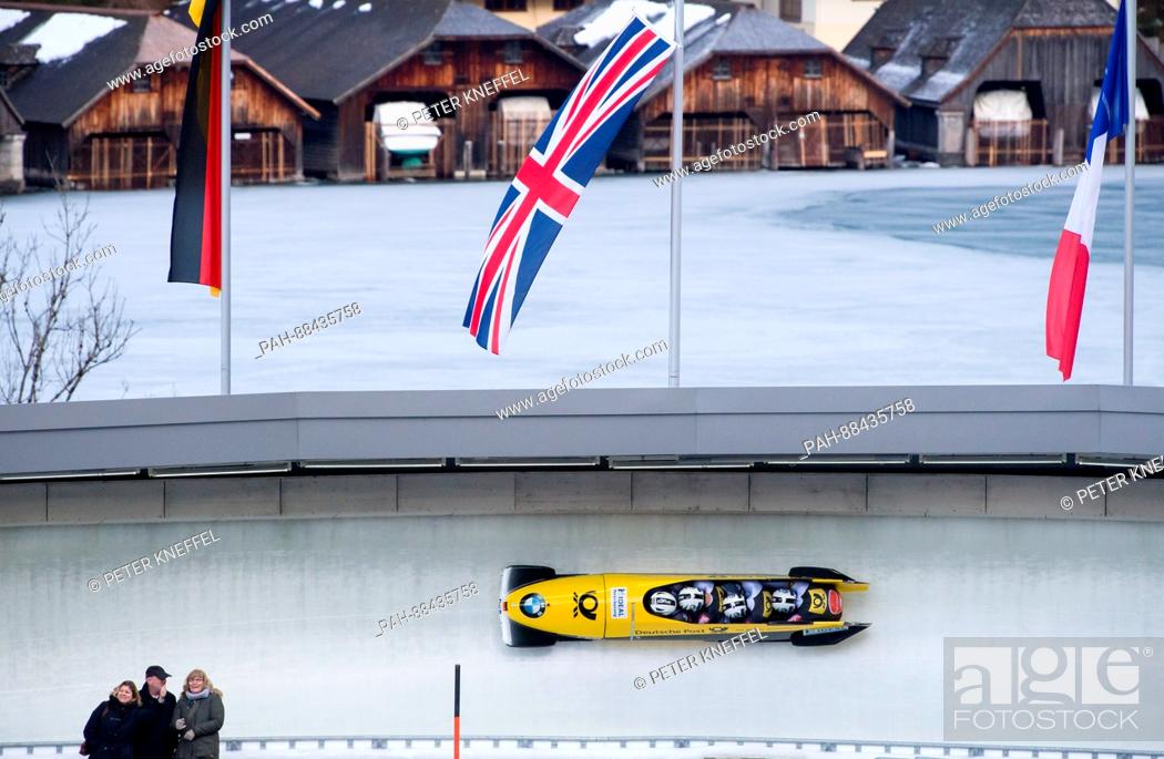 Stock Photo: Four-man bobsleigh with Nico Walther, Kevin Kuske, Kevin Korona and Eric Franke of Germany in action during the 2nd run in Schoenau am Koenigssee, Germany.