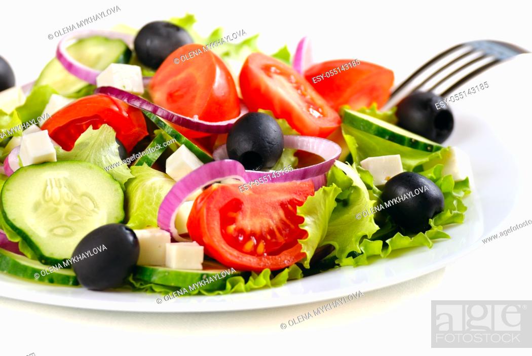Stock Photo: Greek salad in the white plate closeup shot.