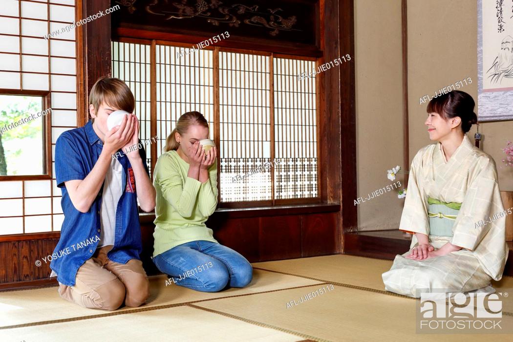 Stock Photo: Caucasian couple enjoying tea ceremony at traditional Japanese house.