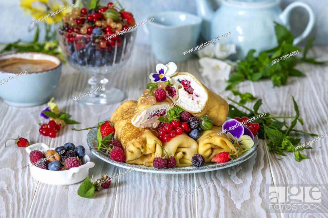 Stock Photo: Crepes with quark and berries.