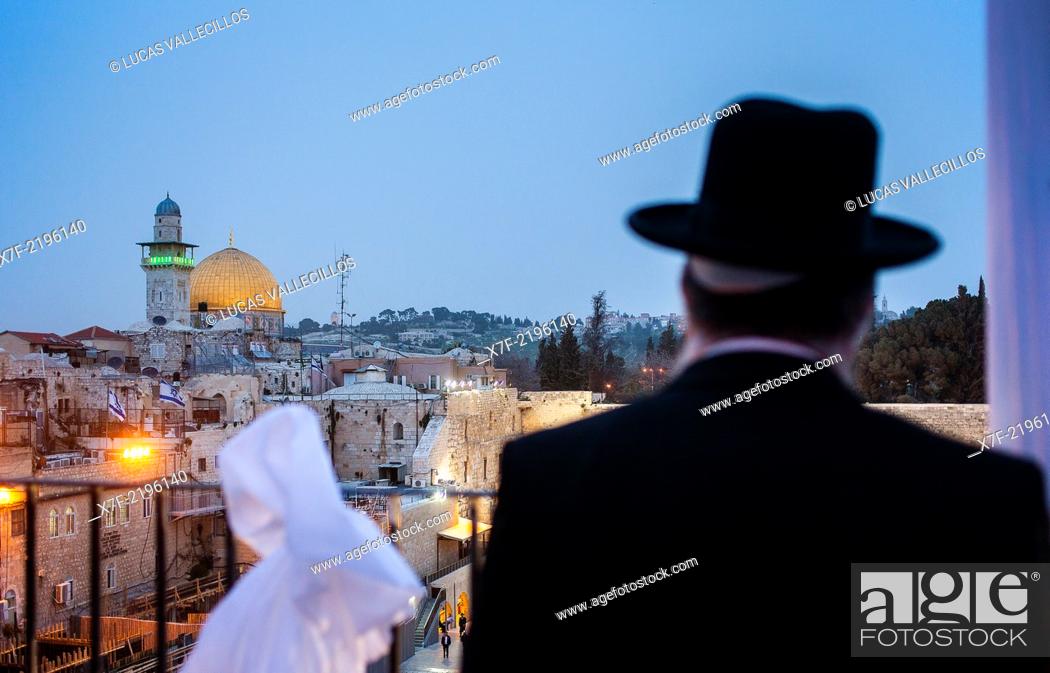 Stock Photo: Orthodox Jew observing the Wailing Wall and Dome of the Rock, Old City, Jerusalem, Israel.