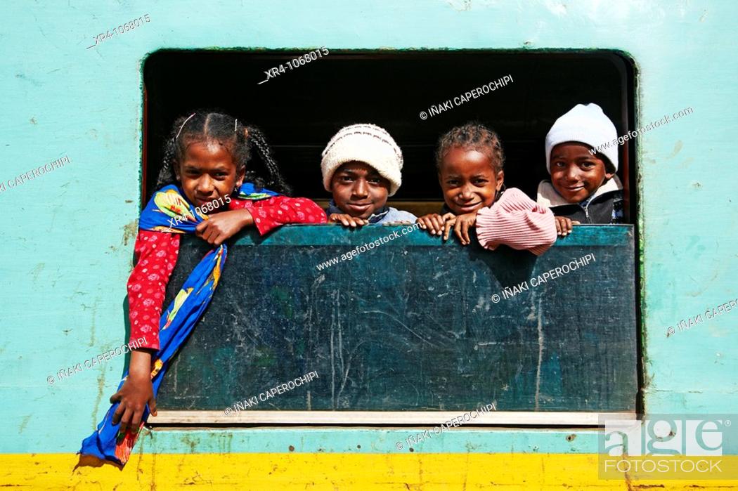Stock Photo: Four children,  Madagascar FCE Jungle Express, Fianarantsoa train station,  Fianarantsoa, Madagascar, Africa.