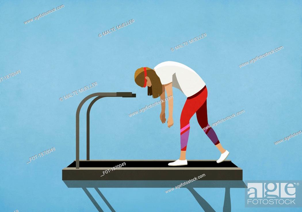 Stock Photo: Tired woman walking on treadmill.