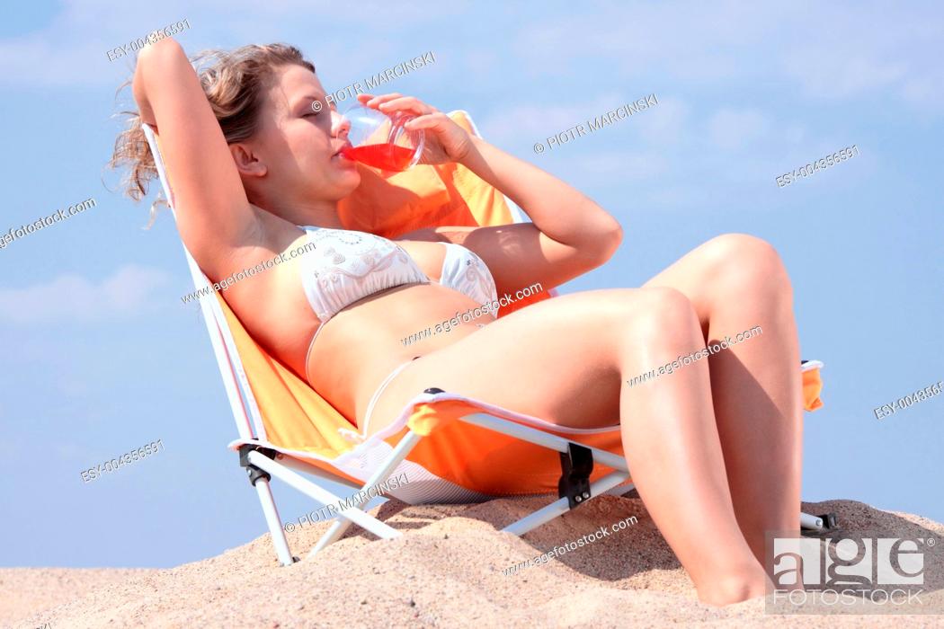 Stock Photo: Beautifull blond girl in bikini sunbathing.