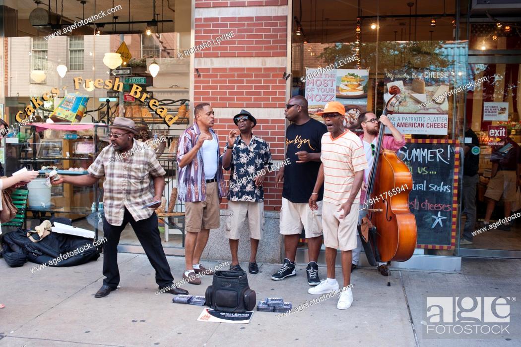 Stock Photo: Street musicians sing doo-wop songs on Bleecker Street in Greenwich Village in New York as they entertain the passing tourists and annoy the heck out of the.