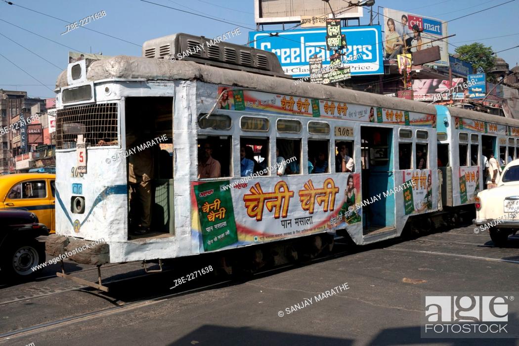 Stock Photo: A tram crosses a junction near college street in Kolkata (Calcutta), West Bengal, India. Started by the Calcutta Tramways Company on 24 February 1873.