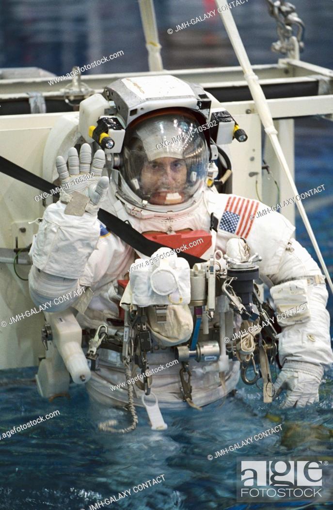 Stock Photo: Astronaut Philippe Perrin, STS-111 mission specialist, attired in a training version of the Extravehicular Mobility Unit (EMU) space suit.
