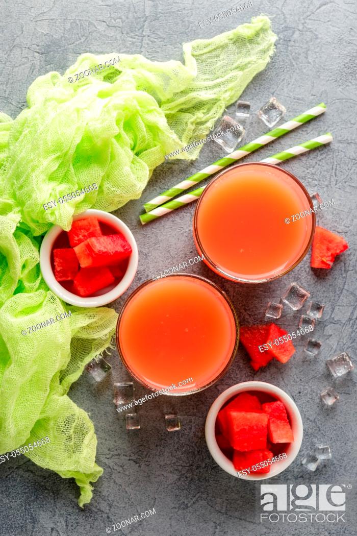 Stock Photo: Watermelon drink with ice in glasses on gray concrete background. Top view.