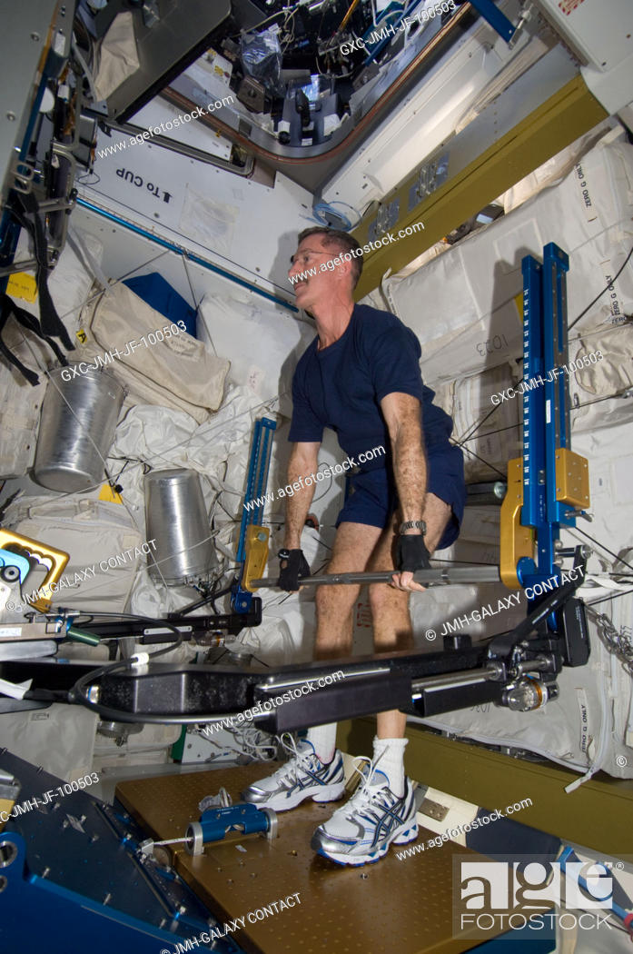Stock Photo: NASA astronaut Dan Burbank, Expedition 30 commander, exercises using the advanced Resistive Exercise Device (aRED) in the Tranquility node of the International.