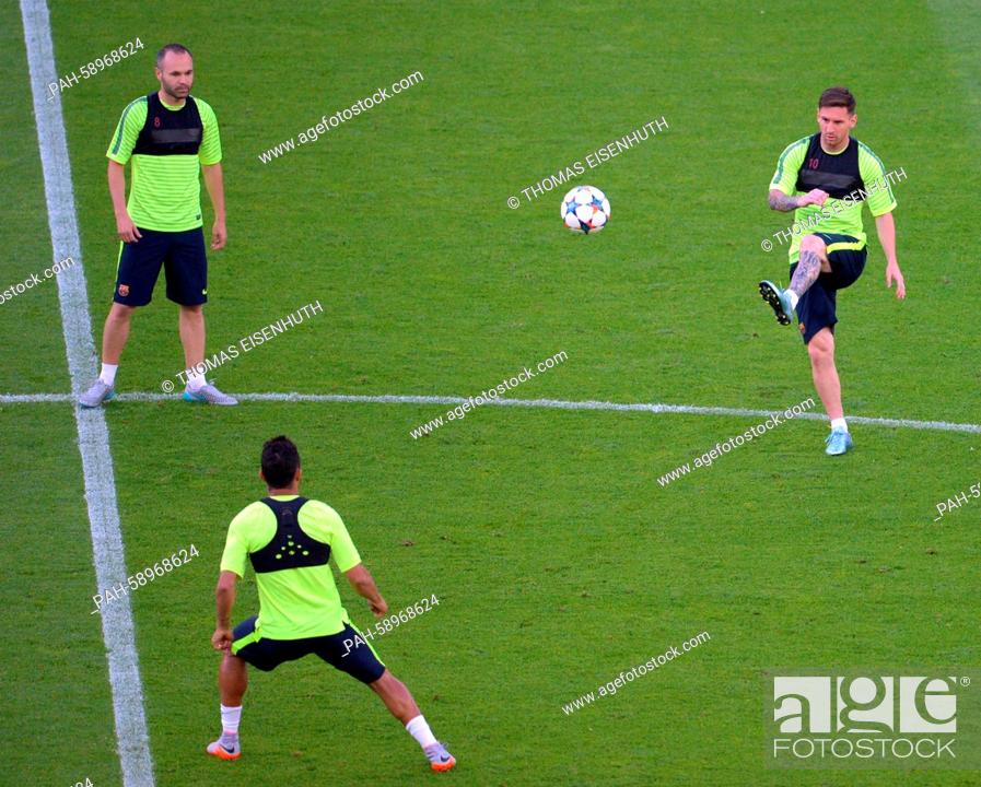 Stock Photo: Andres Iniesta (L) and Lionel Messi of Barcelona FC during the final team training at the Olympiastadion in Berlin, Germany, 05 June 2015.