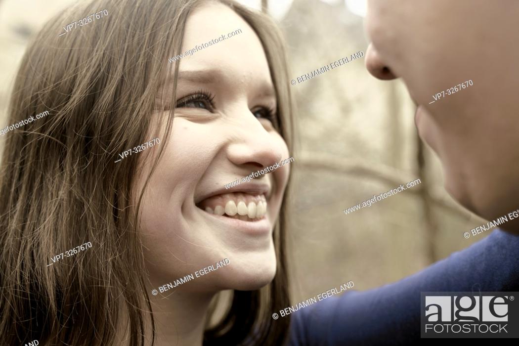 Stock Photo: happy woman looking at man, outdoors in nature, in Cottbus, Brandenburg, Germany.