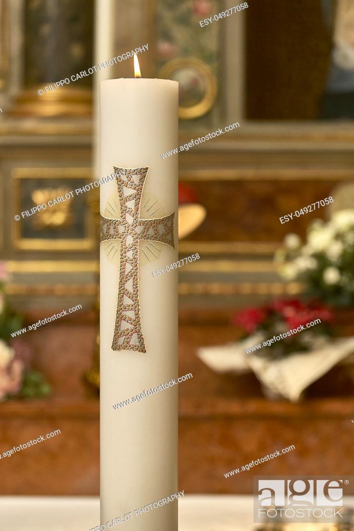 Stock Photo: Large lit Easter candle used as a religious object in churches for various types of celebrations.