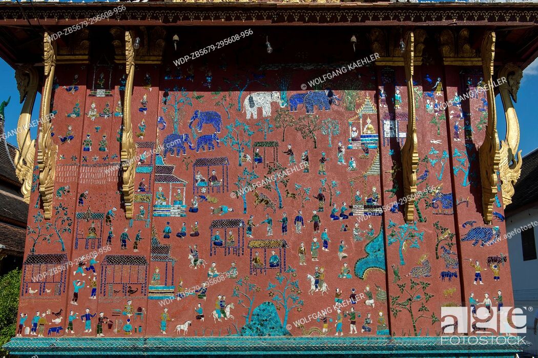 Stock Photo: Some of the exterior walls of the buildings at the Wat Xieng Thong in the UNESCO world heritage town of Luang Prabang in Central Laos contain colorful mosaics.