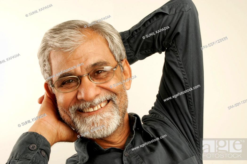 South Asian Indian old man late fifties with gray hair and beard wearing  dark blue shirt and..., Stock Photo, Picture And Rights Managed Image. Pic.  DPA-SSK-123636 | agefotostock