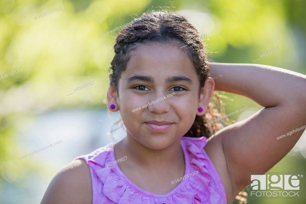 Stock Photo - Portrait of Hispanic teen girl smiling.