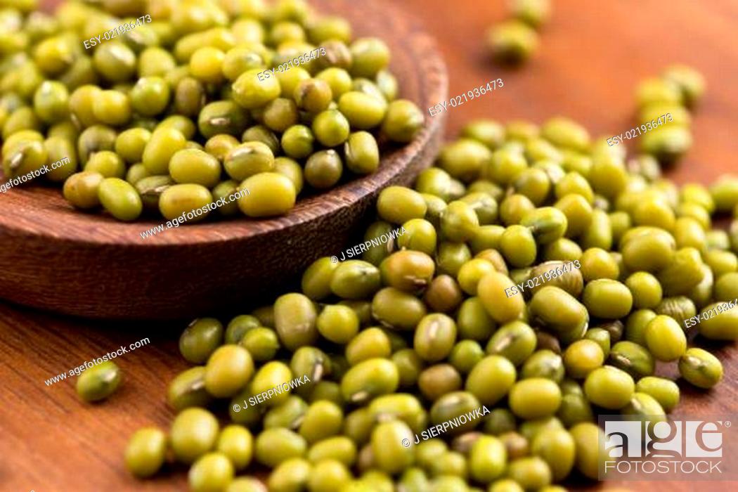 Stock Photo: Mung beans over wooden spoon.