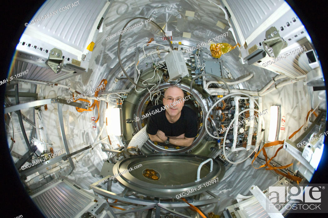 Stock Photo: A fisheye lens attached to an electronic still camera was used to capture this image of NASA astronaut Don Pettit, Expedition 31 flight engineer.