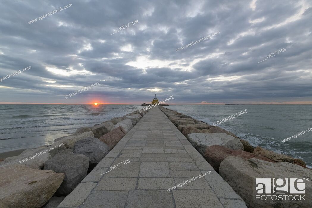Stock Photo: Dike and lighthouse at Sunrise, Punta Sabbioni, Venice, Venetian Lagoon, Mediterranean Sea, Veneto, Italy.